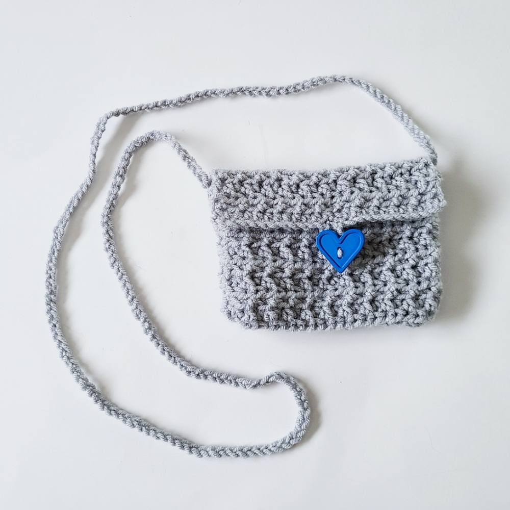Grey crochet cross body mini bag